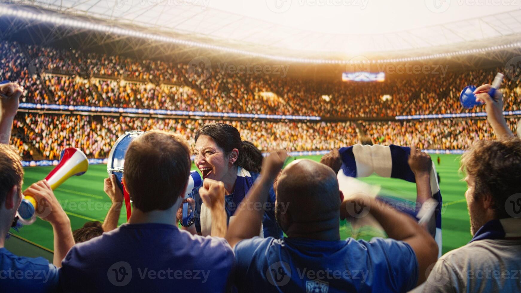 A packed soccer stadium with fans in blue and red jerseys cheering during a daytime match, capturing the electric atmosphere of a Liga MX game.